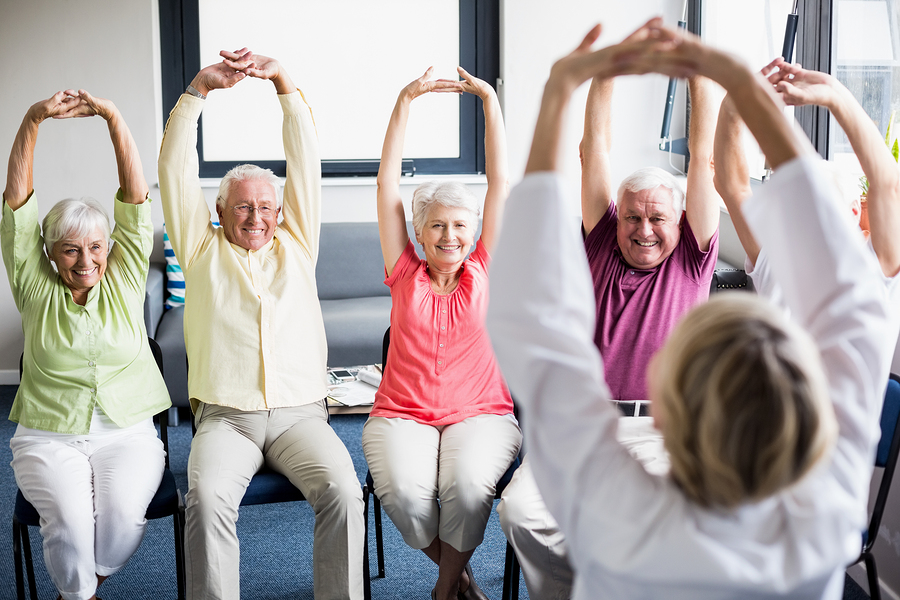 bigstock-Seniors-doing-exercises-in-a-r-138261863